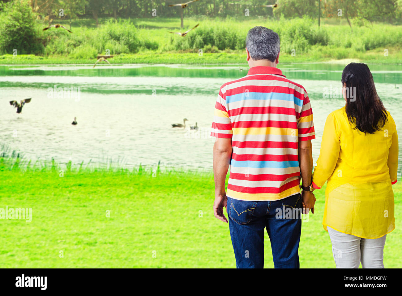 Rear view woman standing riverbank hi-res stock photography and images ...