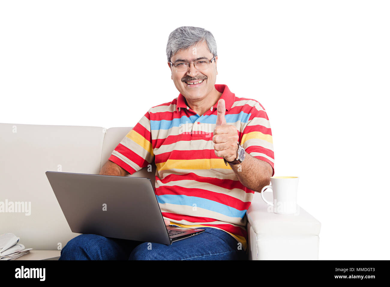One Senior Man Using Laptop And Showing Thumbs-up Living-Room At-Home Stock Photo