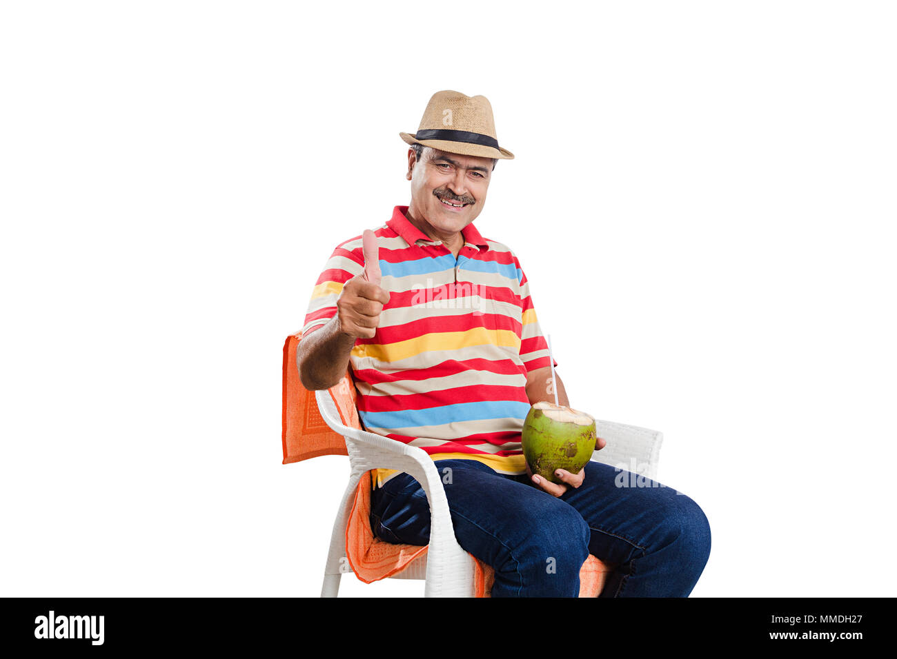 One Senior man Sitting Chair Drinking Coconut-Juice And Giving Thumbs-up Stock Photo