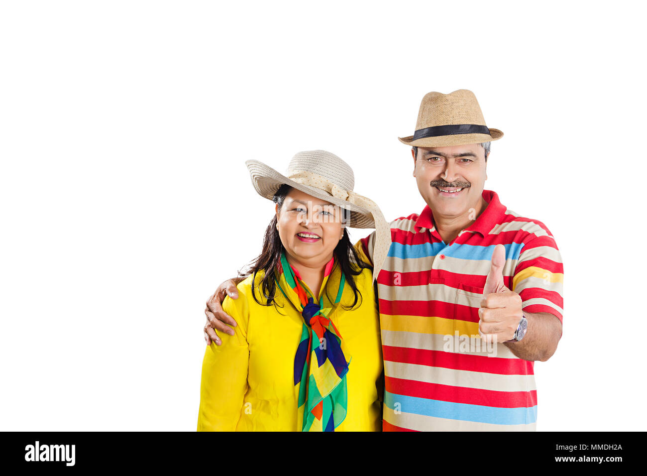 Smiling Senior Couple Together Wearing Cowboy hats Showing Thumbs-up Good-Luck Stock Photo