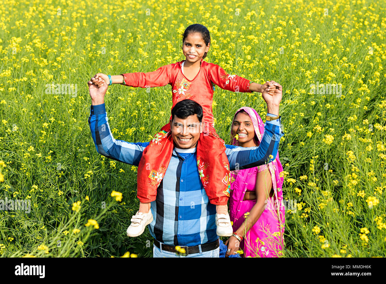 Happy Rural Villager Mother father Carrying Daughter shoulder Farm Enjoying Stock Photo