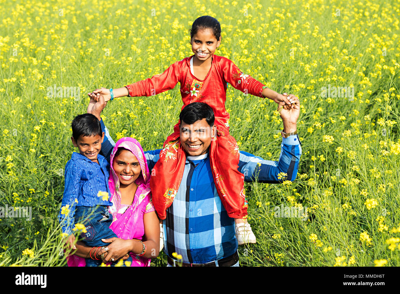 Rural Villager Family Parents And Children Fun Enjoy Mustard Field Stock Photo Alamy