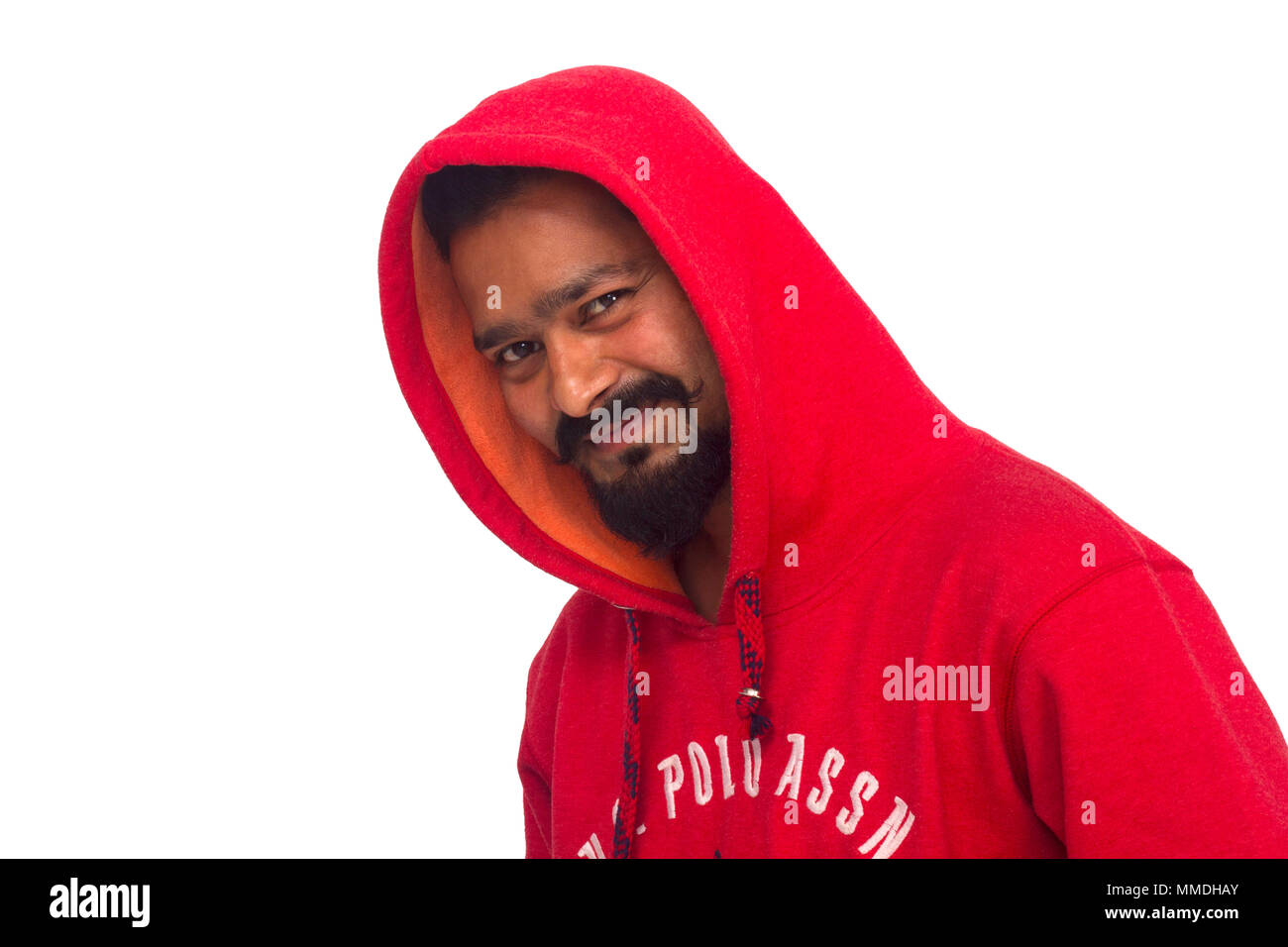 Young man wearing red hoodie facing camera. Side pose Stock Photo