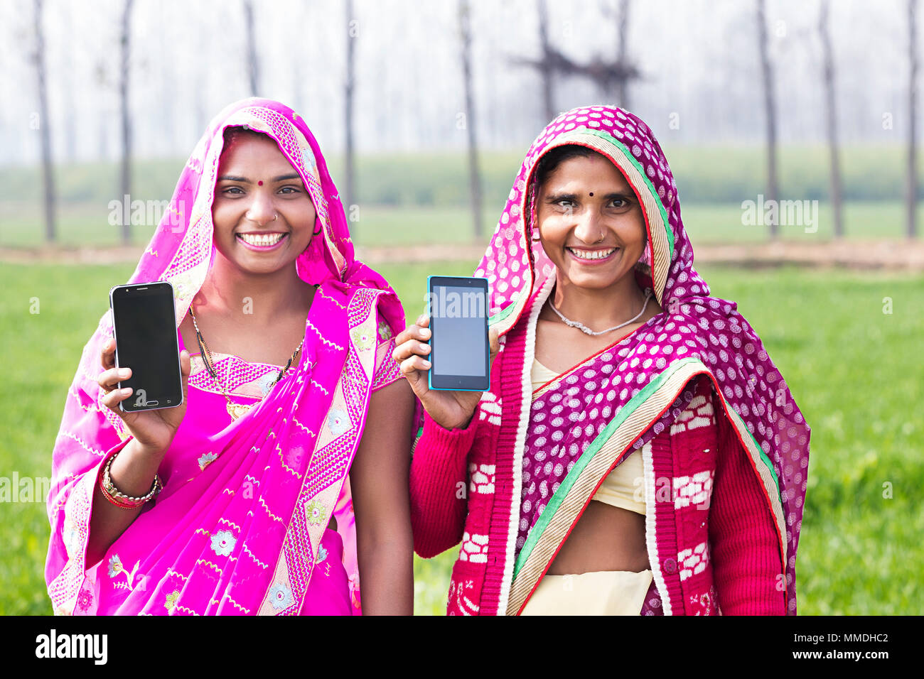 Smiling Two Rural Farmer Women Friend Showing Cell-Phone Field Village Stock Photo