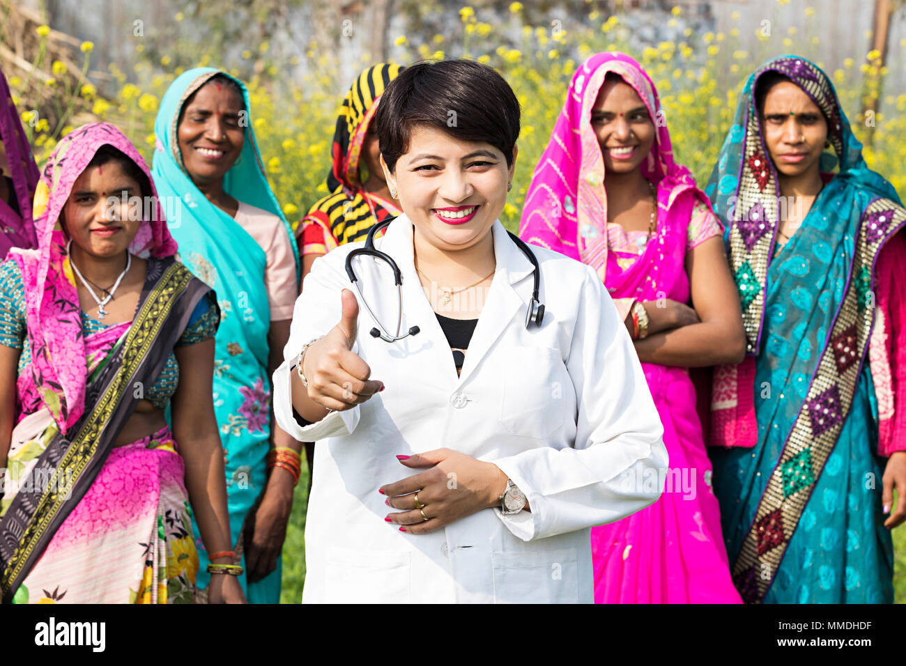 Rural Villager Womens And Government Doctor Showing Thumbsup Good Luck