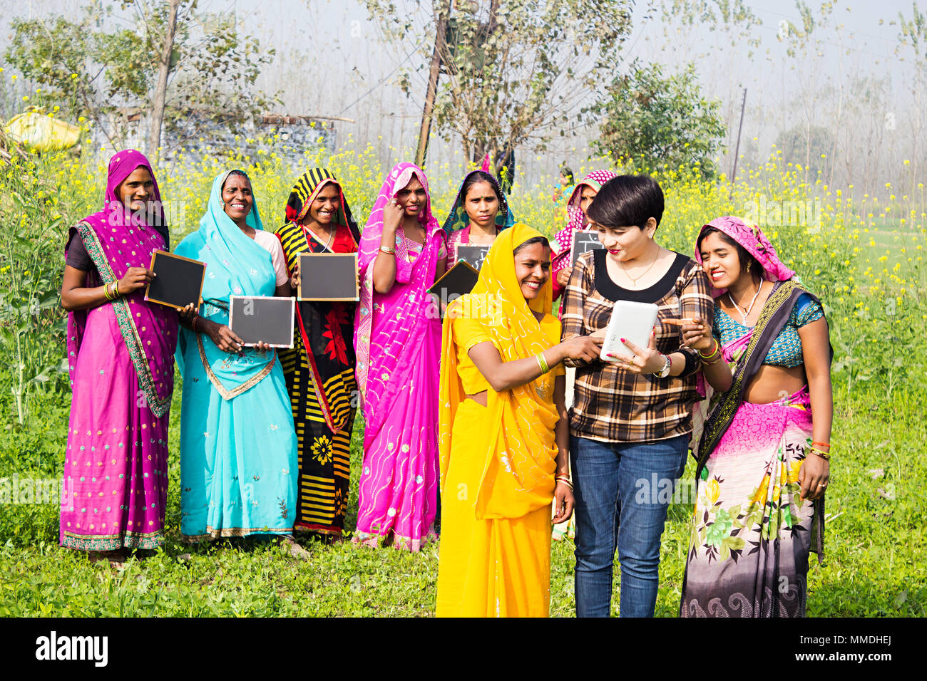 Indian Rural Farmer Female, Advisor Using Mobile-Tablet E-Learning Awareness In--Field Stock Photo