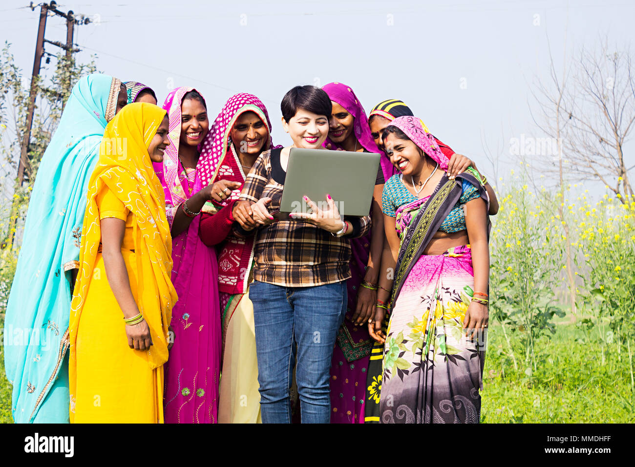 Group Rural Womens And Advisor Watching Laptop Screen E-Learning Technology Farm Stock Photo