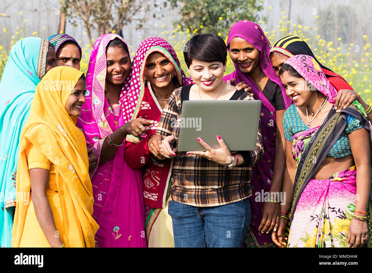 Rural Womens And Advisor Watching Laptop Screen E-Learning Awareness Farm-Village Stock Photo