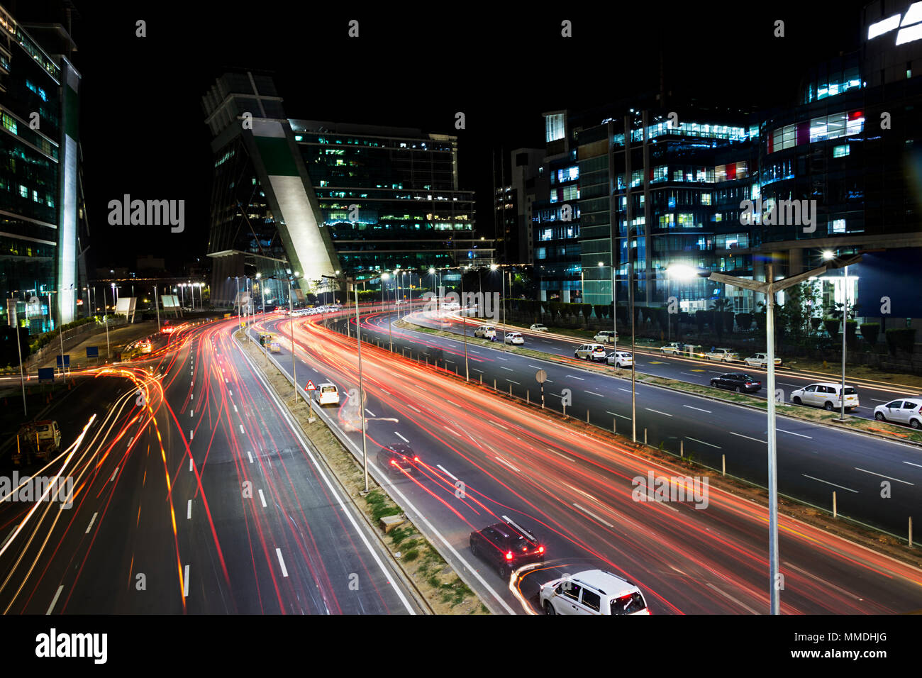 Urban City night traffic, Blur traffic motion and car lights in rush Stock Photo
