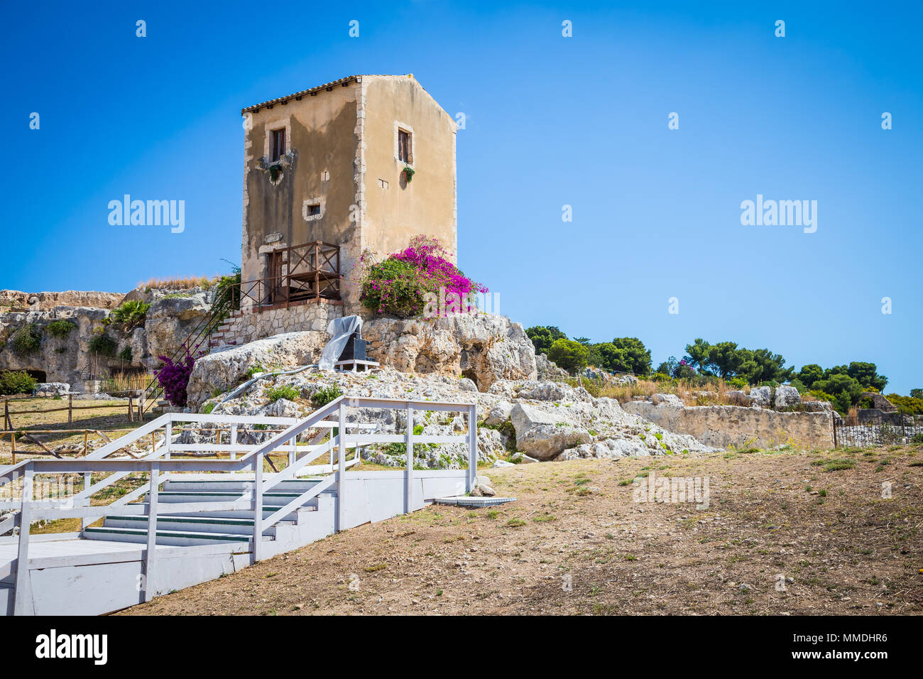 Traditional old Sicilian house during a sunny day with a wonderful blue sky background. Stock Photo