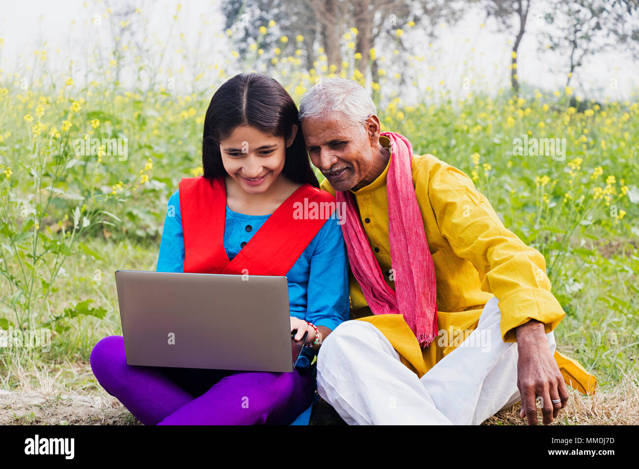 Rural Villager, Grandfather And Granddaughter Sitting Farm laptop ...