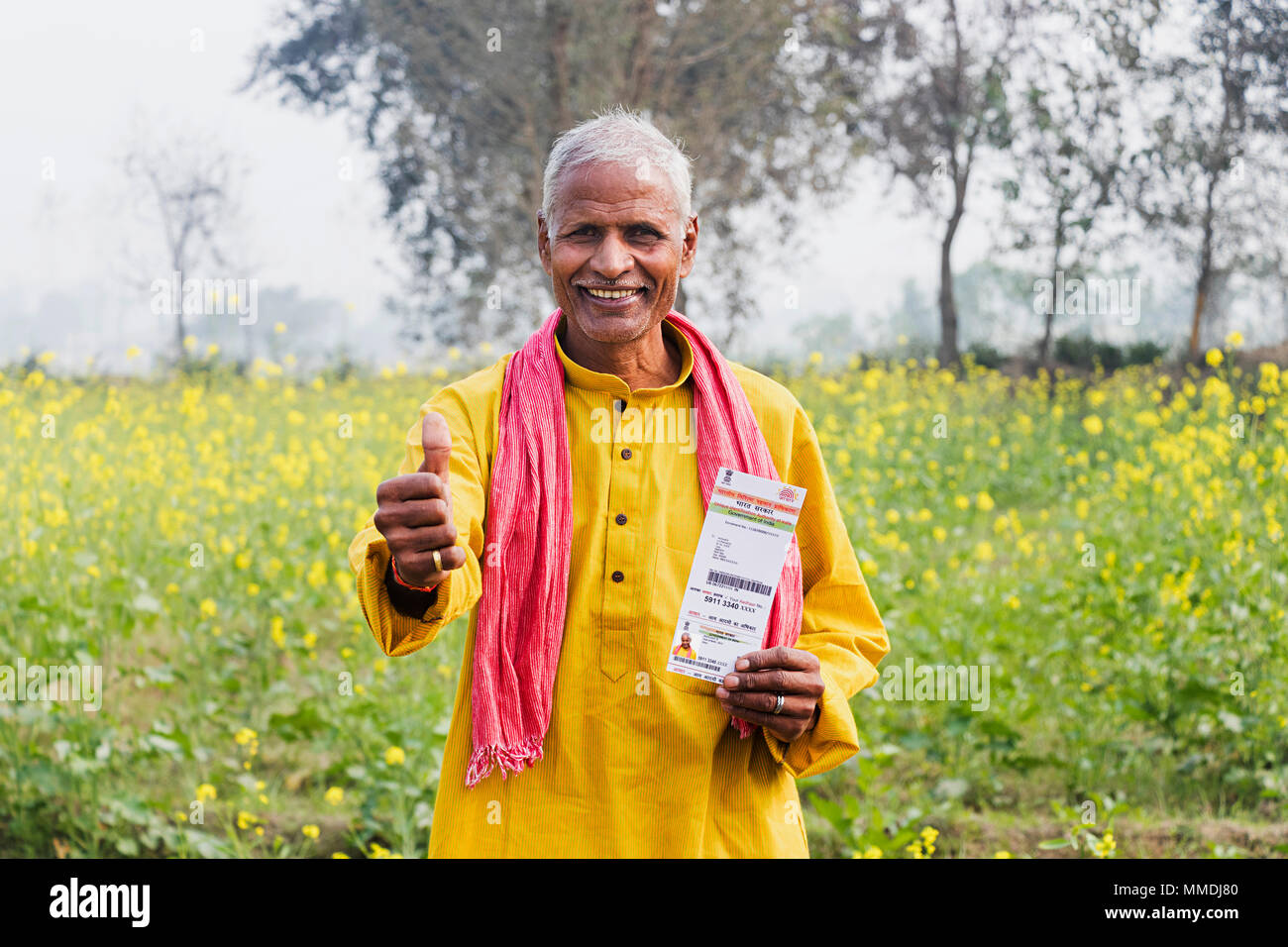 One Old Man Holding Aadhaar-Card While Showing Thumbs-up Rural Village Stock Photo