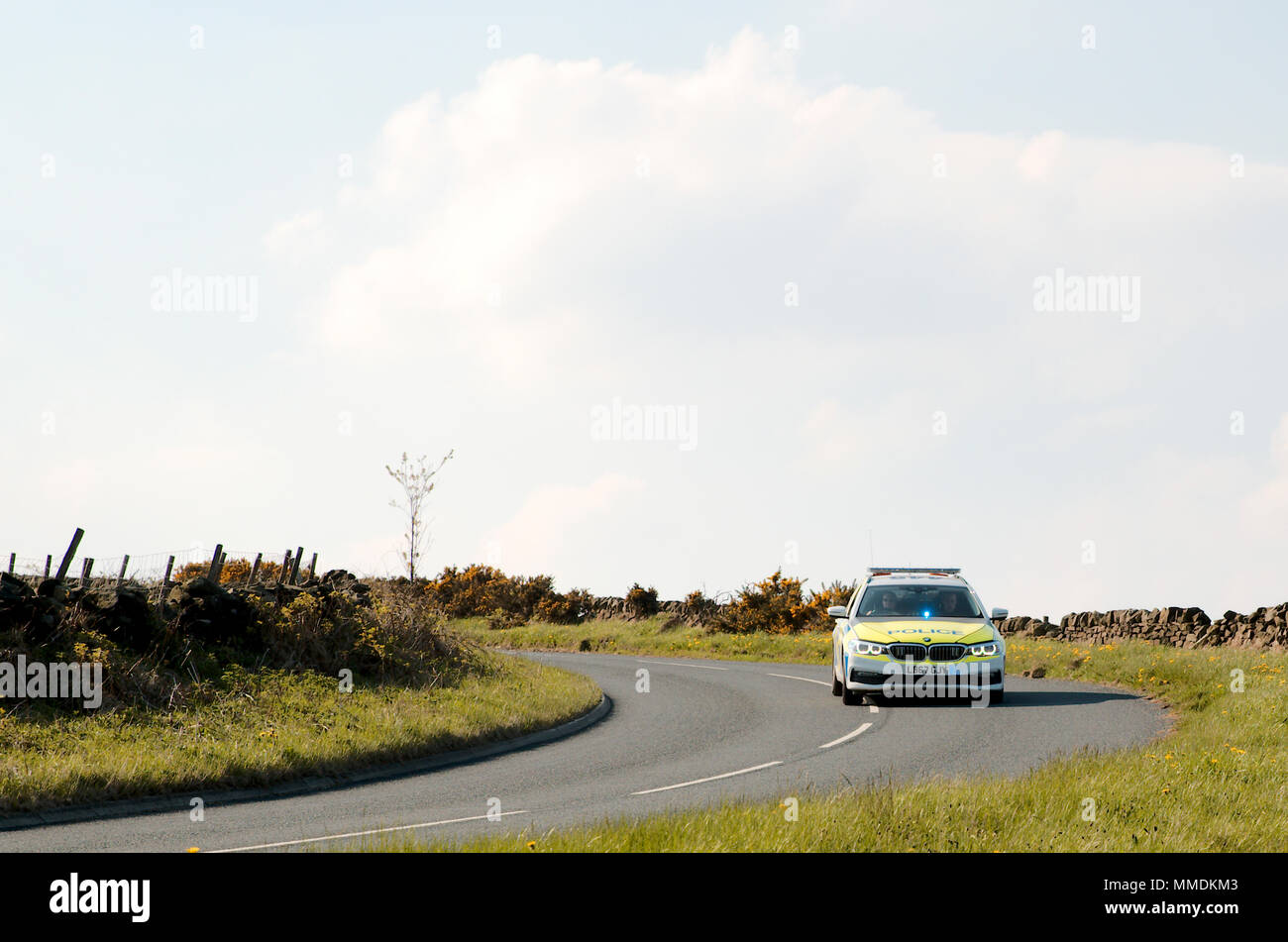 Police car with Blue light flashing in the windscreen Stock Photo