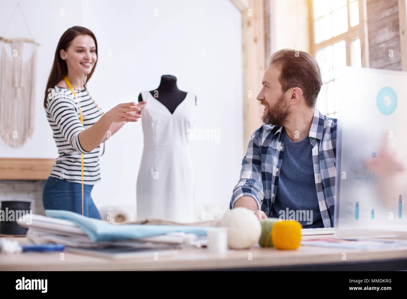 Gay couple tailors discussing collection Stock Photo