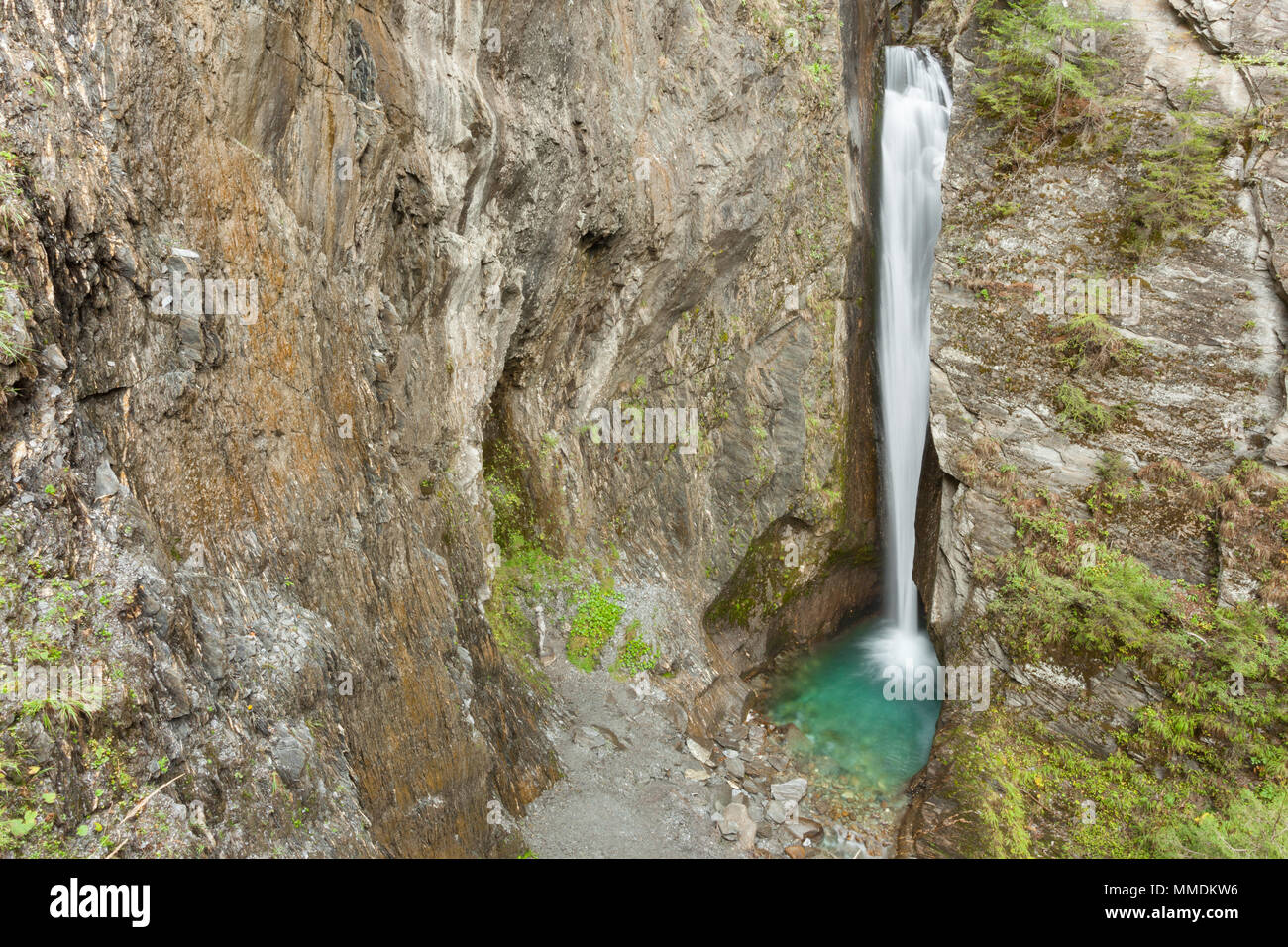 small waterfall and lake among the rock Stock Photo - Alamy