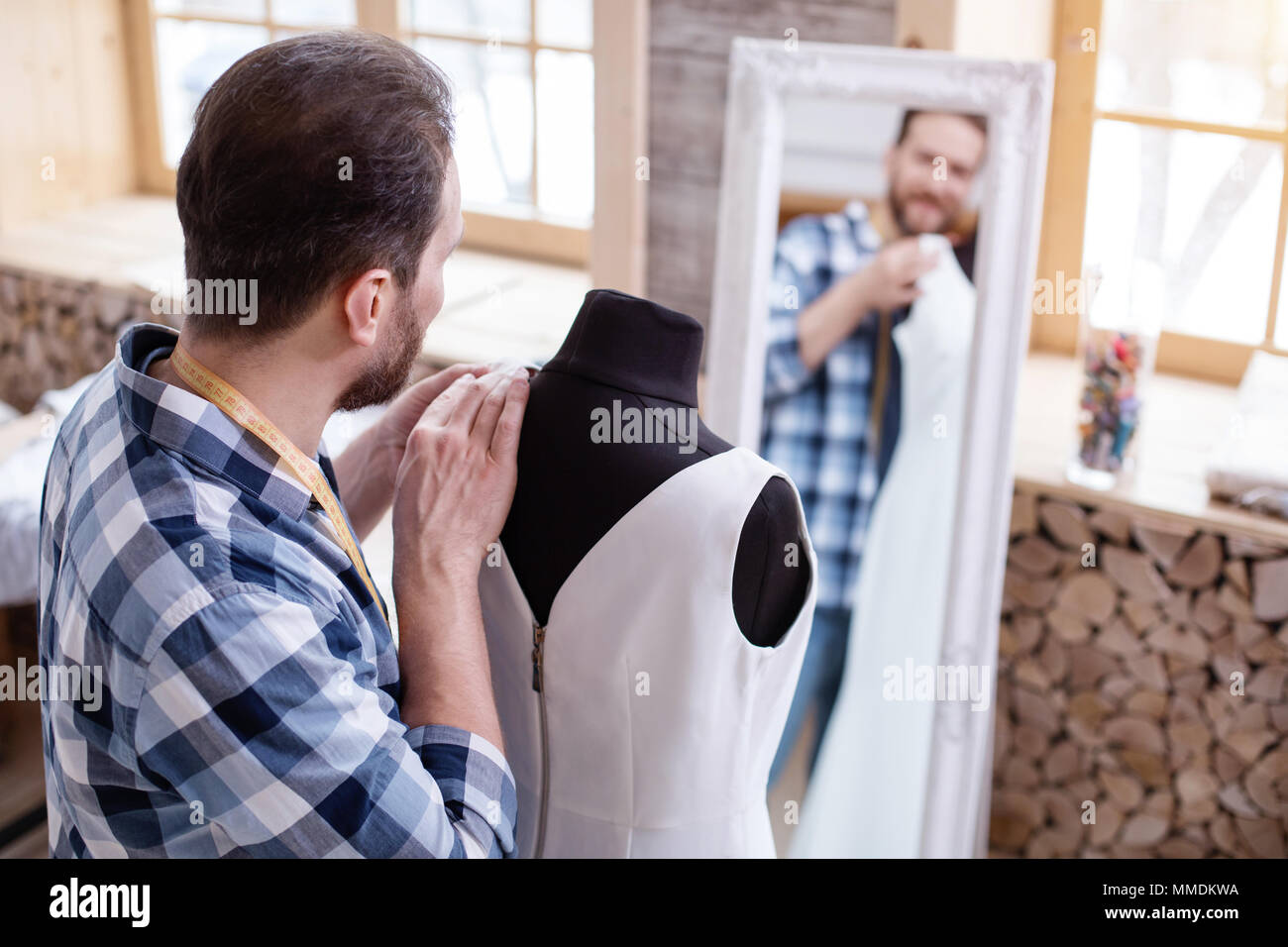 Professional male couturier perfecting design Stock Photo