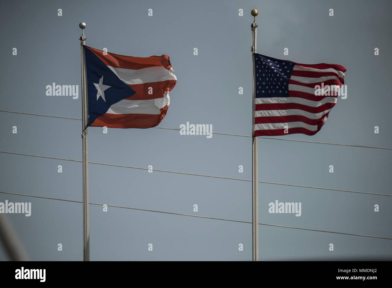 The flags of Puerto Rico and the United States fly at the 141st Air