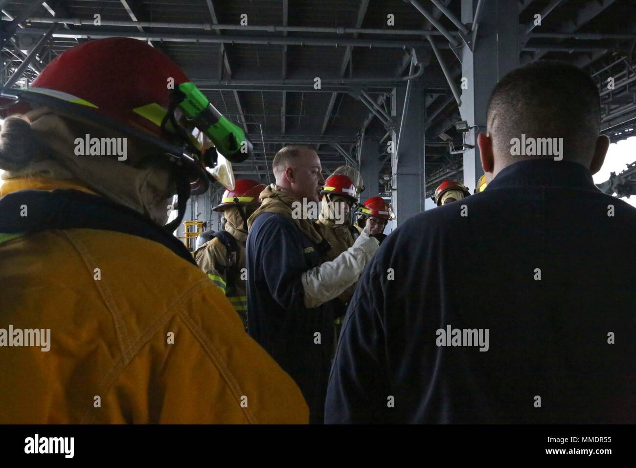 Sailors Don Protective Gear During A Fire Evacuation Drill Aboard