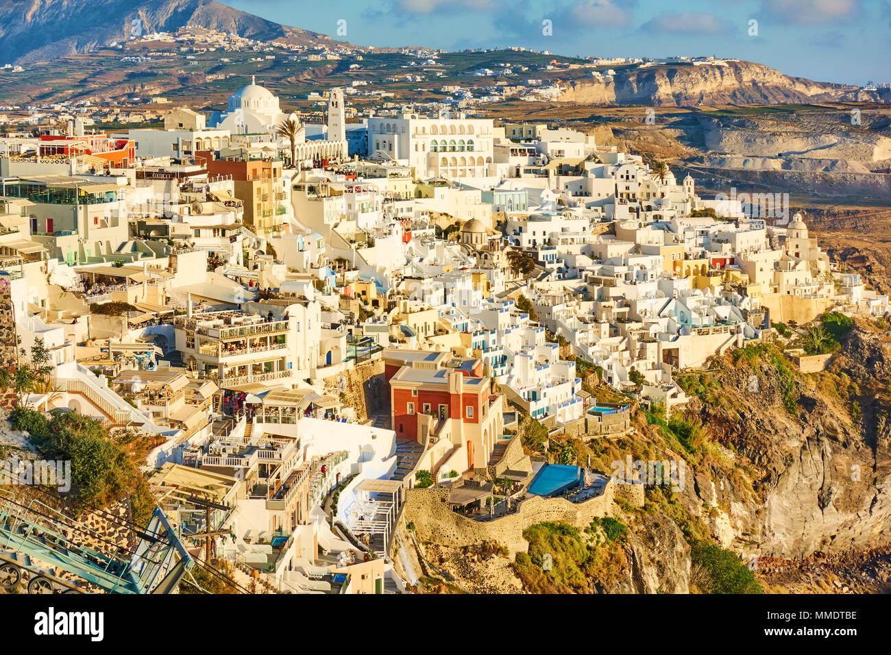 Panoramic view of Thira town on the very brink of a precipice in the evening, Santorini, Greece Stock Photo