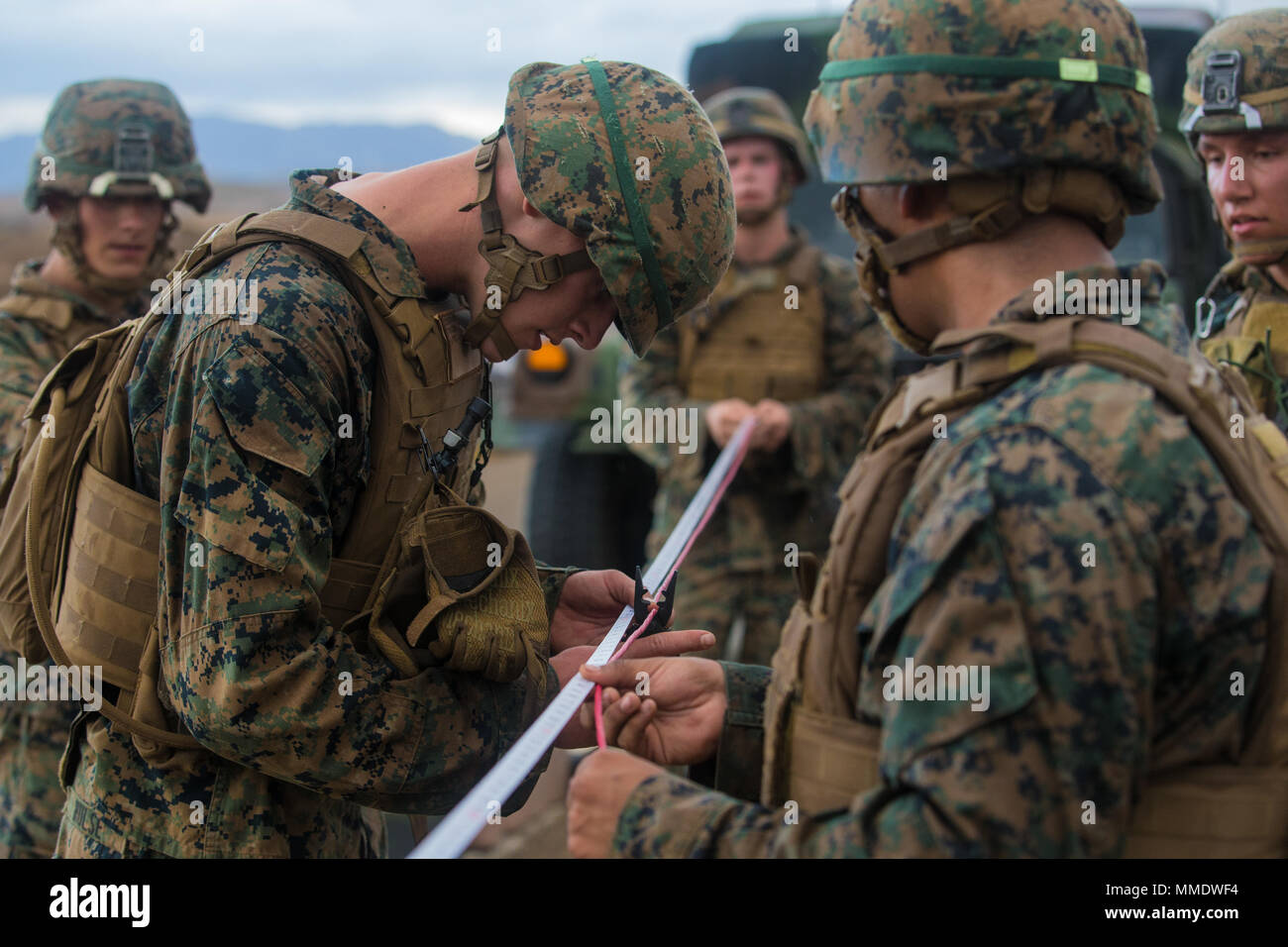 U.S. Marines create a detonating cord for a linear charge during their