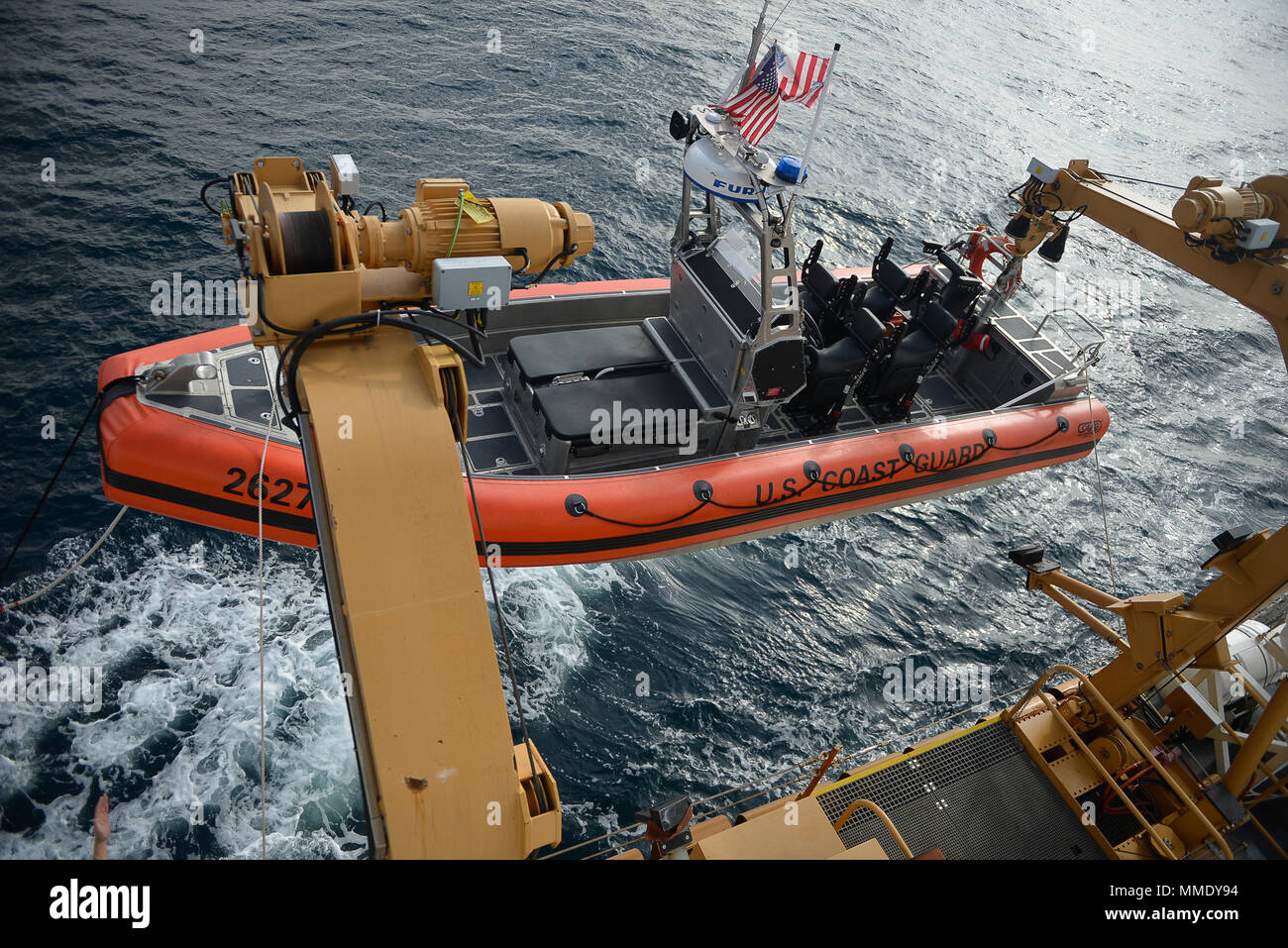 Coast Guard cutter Active's small boat is lowered on Saturday, Oct. 6, 2017. Active performs many of the Coast Guard missions such as search and rescue and counter-narcotics. (U.S. Coast Guard photo by Petty Officer 3rd Class Nicole J. Groll) Stock Photo