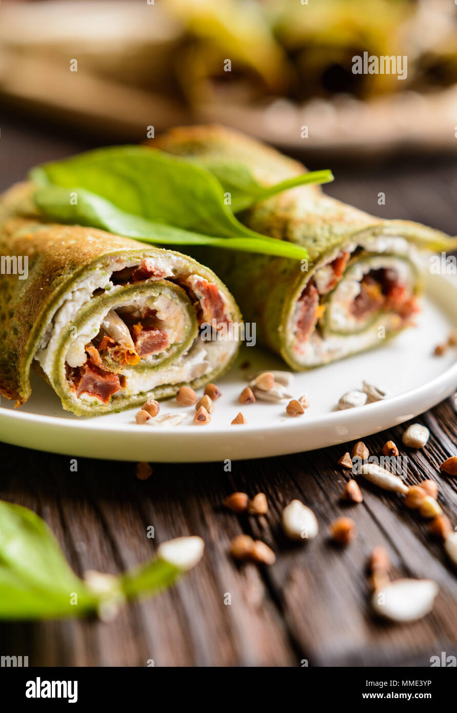Savory spinach pancakes stuffed with Feta cheese, curd, sun dried