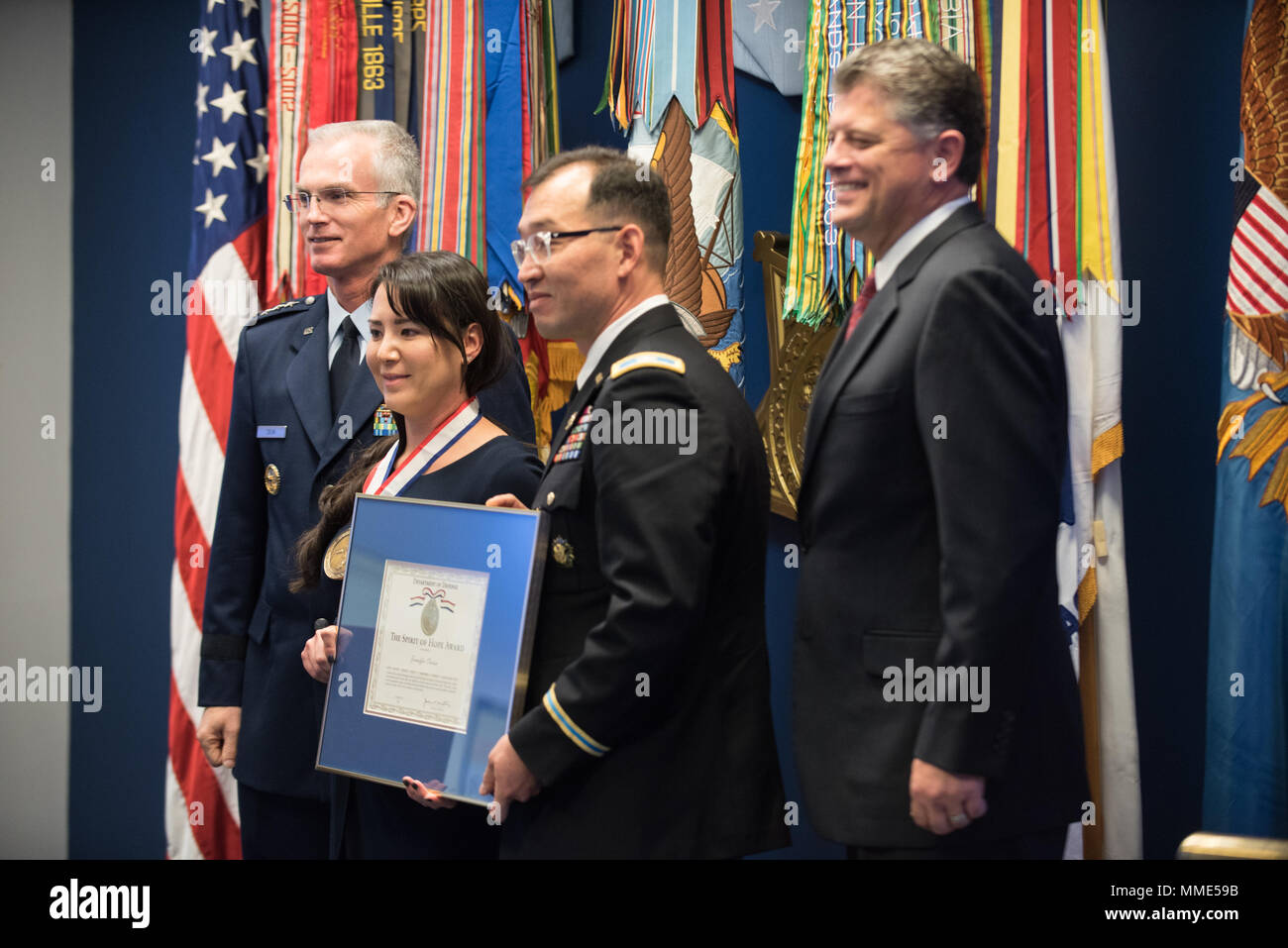 Jennifer Correia, the U.S. Army Awardee, poses for a photo with U.S. Air Force Gen. Paul J. Selva, Vice Chairman of the Joint Chiefs of Staff, and others during the 2017 Spirit of Hope Awards at the Hall of Heroes in the Pentagon, Oct. 26, 2017. The Spirit of Hope Award is awarded to men and women of the U.S. Armed Forces, entertainers, and other distinguished Americans and organizations whose patriotism and service reflect that of Mr. Bob Hope. The recipients selflessly contributed an extraordinary amount of time, talent, or resources to significantly enhance the quality of life or service me Stock Photo