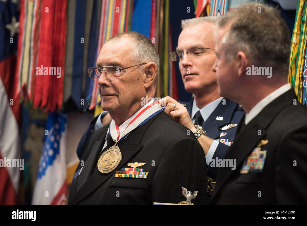 U.S. Air Force Gen. Paul J. Selva, Vice Chairman of the Joint Chiefs of Staff, places the award on Retired U.S. Navy Chief Petty Officer Jim Marshall, the U.S. Navy awardee, during the 2017 Spirit of Hope Awards at the Hall of Heroes in the Pentagon, Oct. 26, 2017. The Spirit of Hope Award is awarded to men and women of the U.S. Armed Forces, entertainers, and other distinguished Americans and organizations whose patriotism and service reflect that of Mr. Bob Hope. The recipients selflessly contributed an extraordinary amount of time, talent, or resources to significantly enhance the quality o Stock Photo