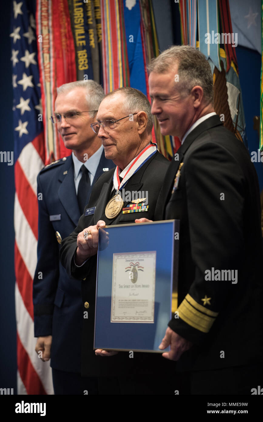 Retired U.S. Navy Chief Petty Officer Jim Marshall, the U.S. Navy awardee, poses for a photo with U.S. Air Force Gen. Paul J. Selva, Vice Chairman of the Joint Chiefs of Staff, and others during the 2017 Spirit of Hope Awards at the Hall of Heroes in the Pentagon, Oct. 26, 2017. The Spirit of Hope Award is awarded to men and women of the U.S. Armed Forces, entertainers, and other distinguished Americans and organizations whose patriotism and service reflect that of Mr. Bob Hope. The recipients selflessly contributed an extraordinary amount of time, talent, or resources to significantly enhance Stock Photo