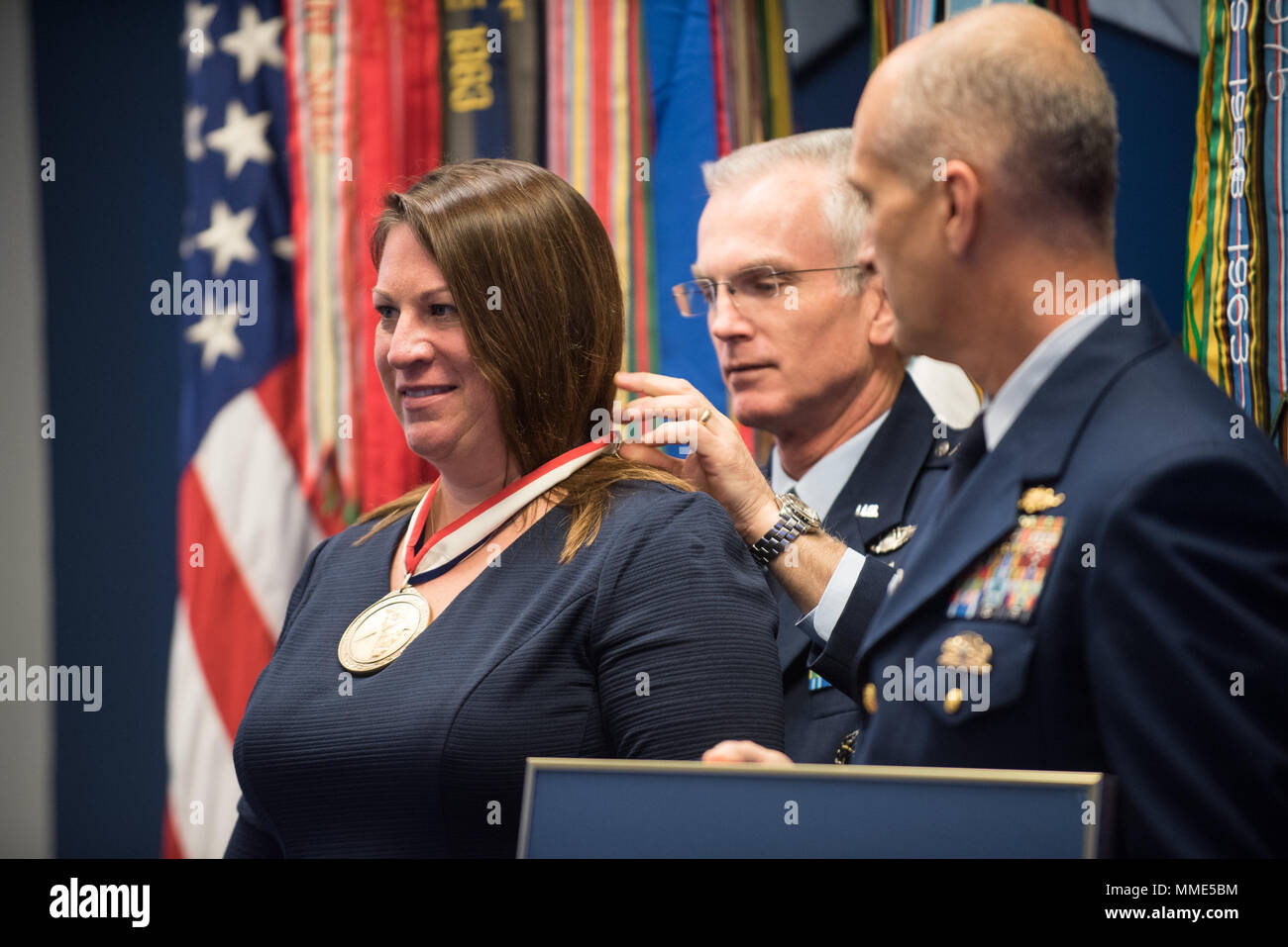 U.S. Air Force Gen. Paul J. Selva, Vice Chairman of the Joint Chiefs of Staff, places the award on Ann O' Connor, accepting on behalf of Trees for Troops - the U.S. Coast Guard awardee, during the 2017 Spirit of Hope Awards at the Hall of Heroes in the Pentagon, Oct. 26, 2017. The Spirit of Hope Award is awarded to men and women of the U.S. Armed Forces, entertainers, and other distinguished Americans and organizations whose patriotism and service reflect that of Mr. Bob Hope. The recipients selflessly contributed an extraordinary amount of time, talent, or resources to significantly enhance t Stock Photo
