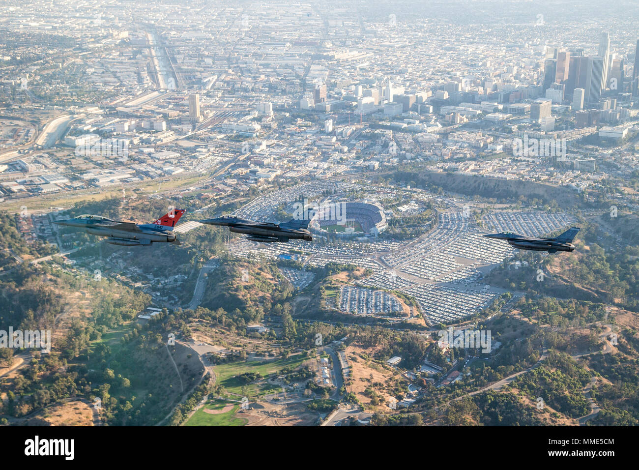 Three F-16 Fighting Falcons from Edwards AFB fly past Dodger Stadium after the ceremonial flyover at the beginning of game two of the 2017 World Series between the Los Angeles Dodgers and Houston Astros Oct. 25. (U.S. Air Force photo by Christopher Okula) Stock Photo