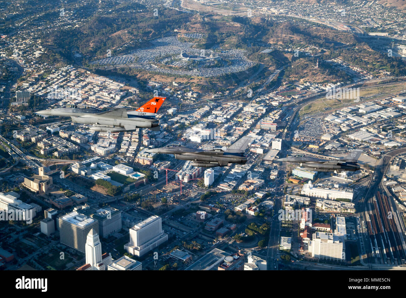 Three F-16 Fighting Falcons from Edwards AFB fly past Dodger Stadium after the ceremonial flyover at the beginning of game two of the 2017 World Series between the Los Angeles Dodgers and Houston Astros Oct. 25. (U.S. Air Force photo by Christopher Okula) Stock Photo