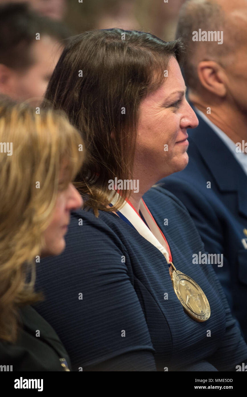 Ann O' Connor, accepting on behalf of Trees for Troops - the U.S. Coast Guard awardee, views other awardees during the 2017 Spirit of Hope Awards at the Hall of Heroes in the Pentagon, Oct. 26, 2017. The Spirit of Hope Award is awarded to men and women of the U.S. Armed Forces, entertainers, and other distinguished Americans and organizations whose patriotism and service reflect that of Mr. Bob Hope. The recipients selflessly contributed an extraordinary amount of time, talent, or resources to significantly enhance the quality of life or service members and their families serving around the wo Stock Photo