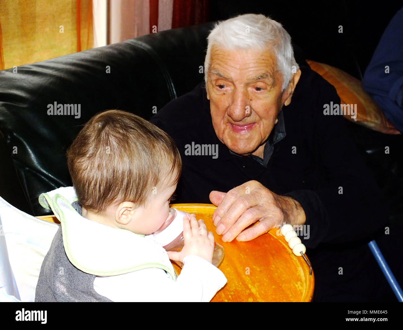 CENTENARIAN & BABY Stock Photo