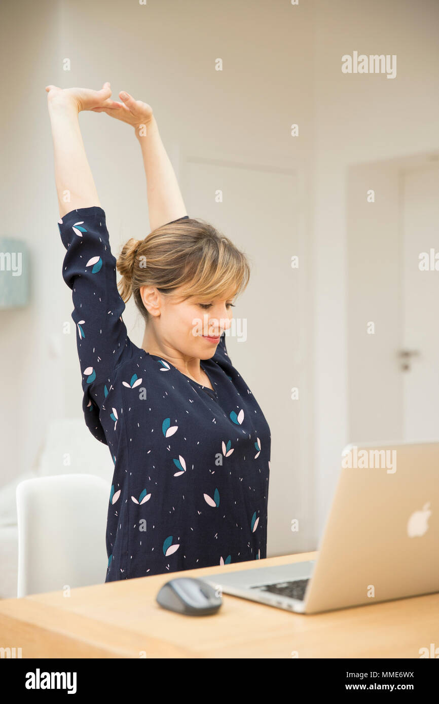 WOMAN STRETCHING Stock Photo
