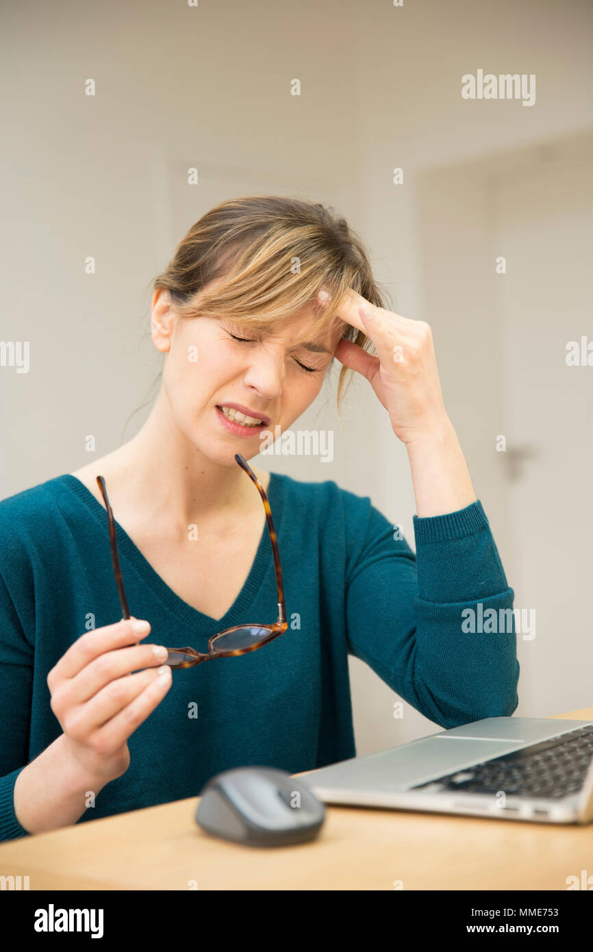 WOMAN WITH HEADACHE Stock Photo