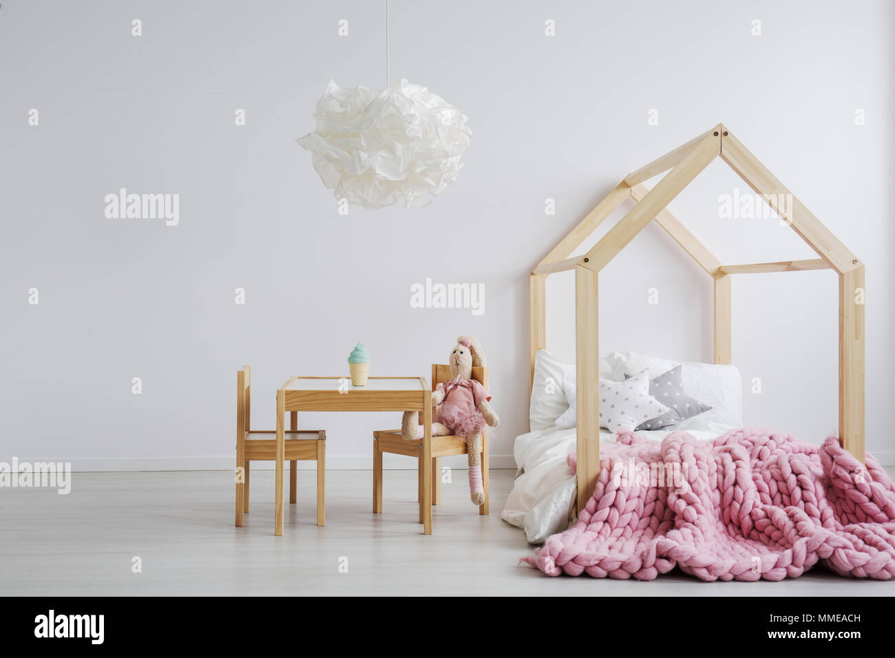 Simple but cute wooden furniture for girl's room Stock Photo