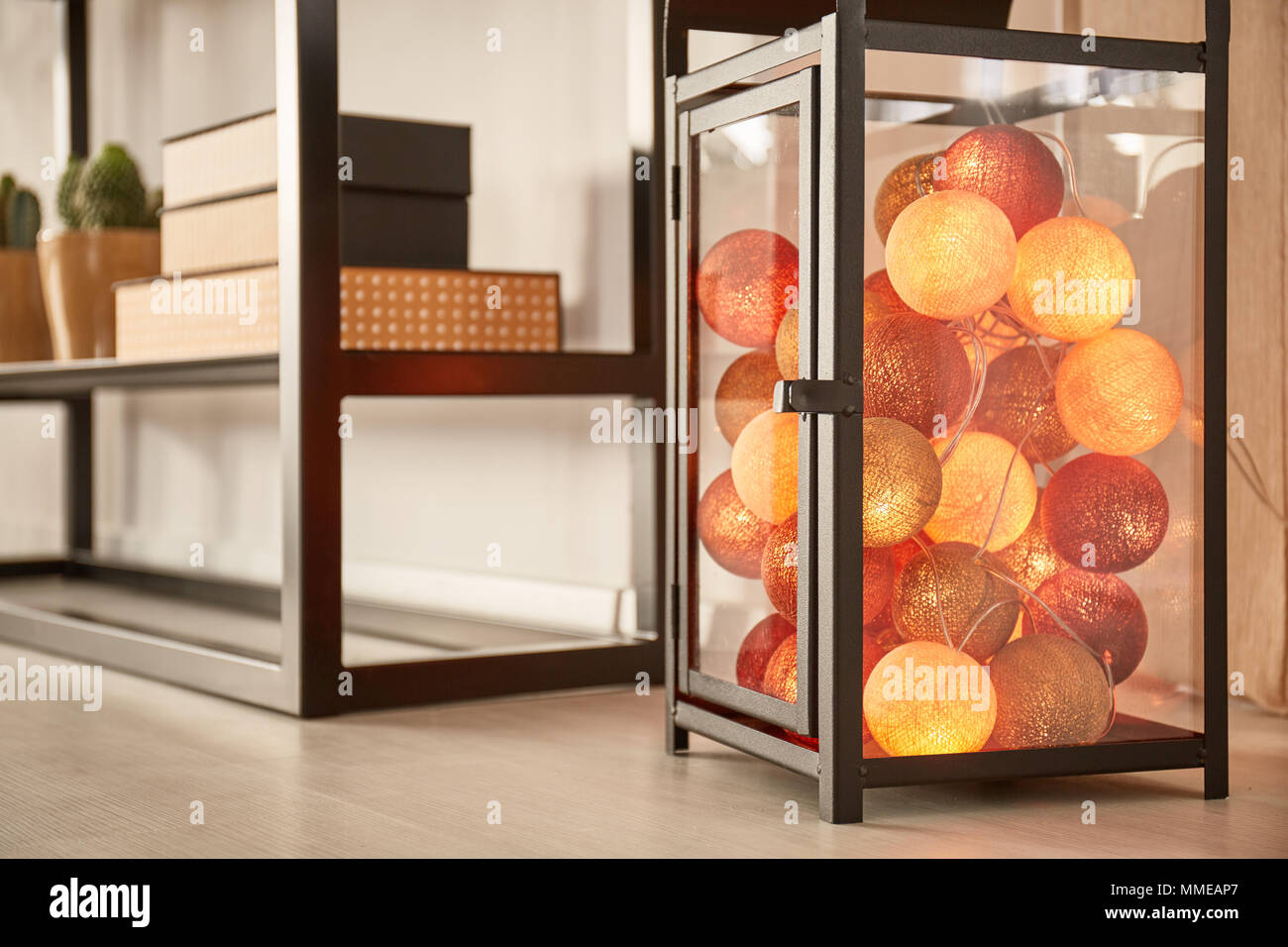 Decorative cotton balls in rustic metal lantern Stock Photo Alamy
