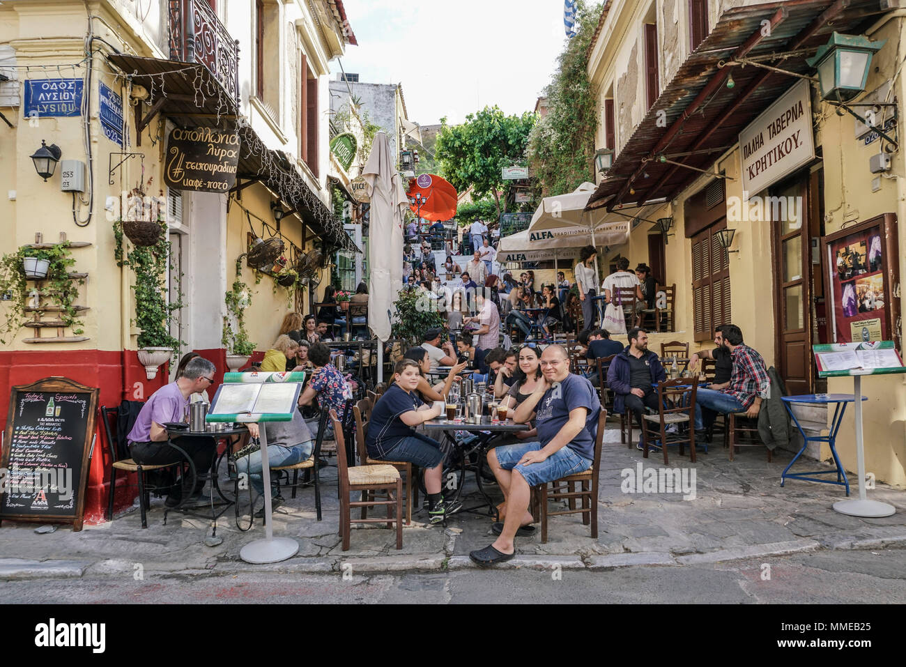 Athens, Greece April 30, 2016 Cozy street cafes full of tourists at