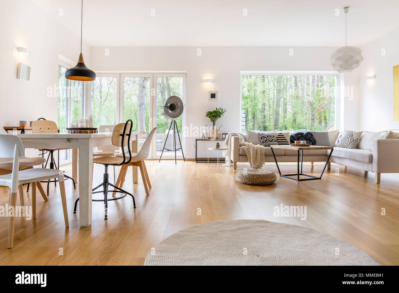 Spacious white living room with wooden floor and white furniture Stock ...