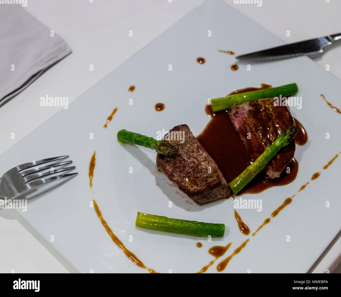 Black Angus steak with green asparagus spears, main course, Stock Photo