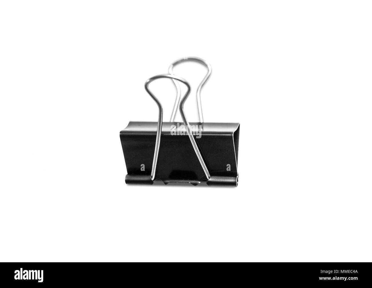 Paper clip isolated from white background. A paperclip is a device for