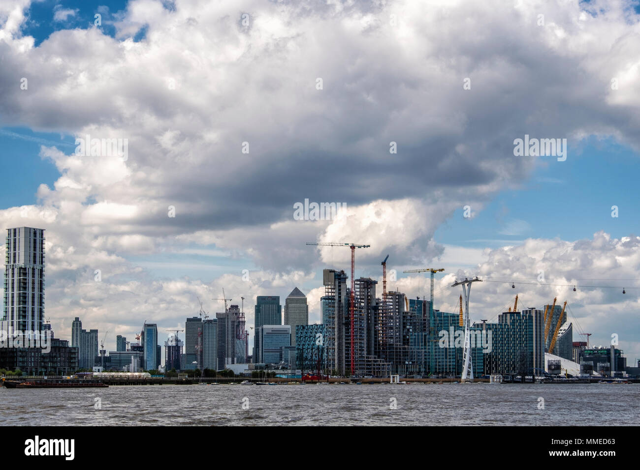 London, Greenwich. City skyline view. New-build apartment buildings at Greenwich peninsula and Canary Wharf Financial district Stock Photo