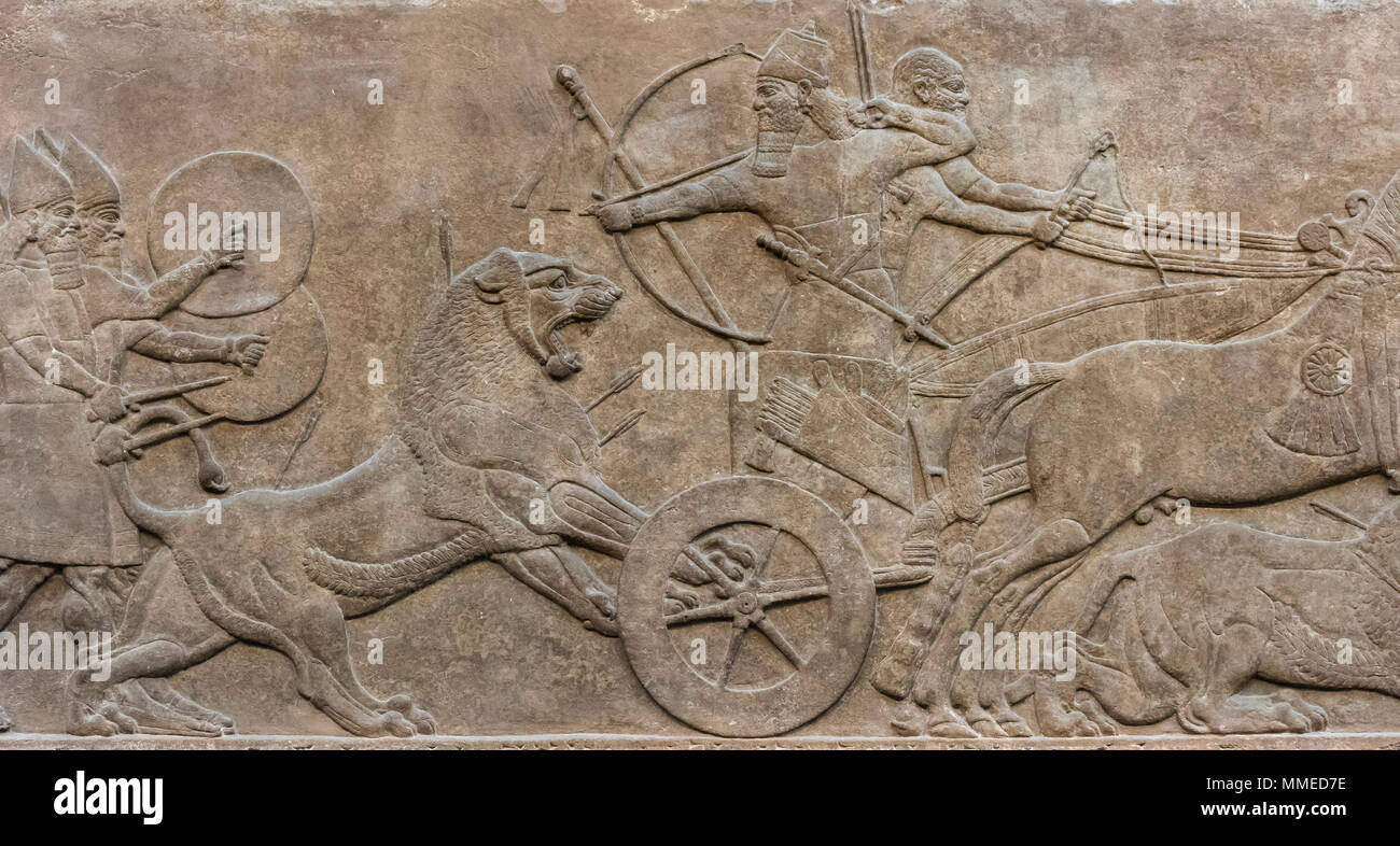 London. England. British Museum. King Ashurnasirpal II Hunting Lions. Stone wall panel relief, (865-860 BC) from the North-West Palace of Ashurnasirpa Stock Photo