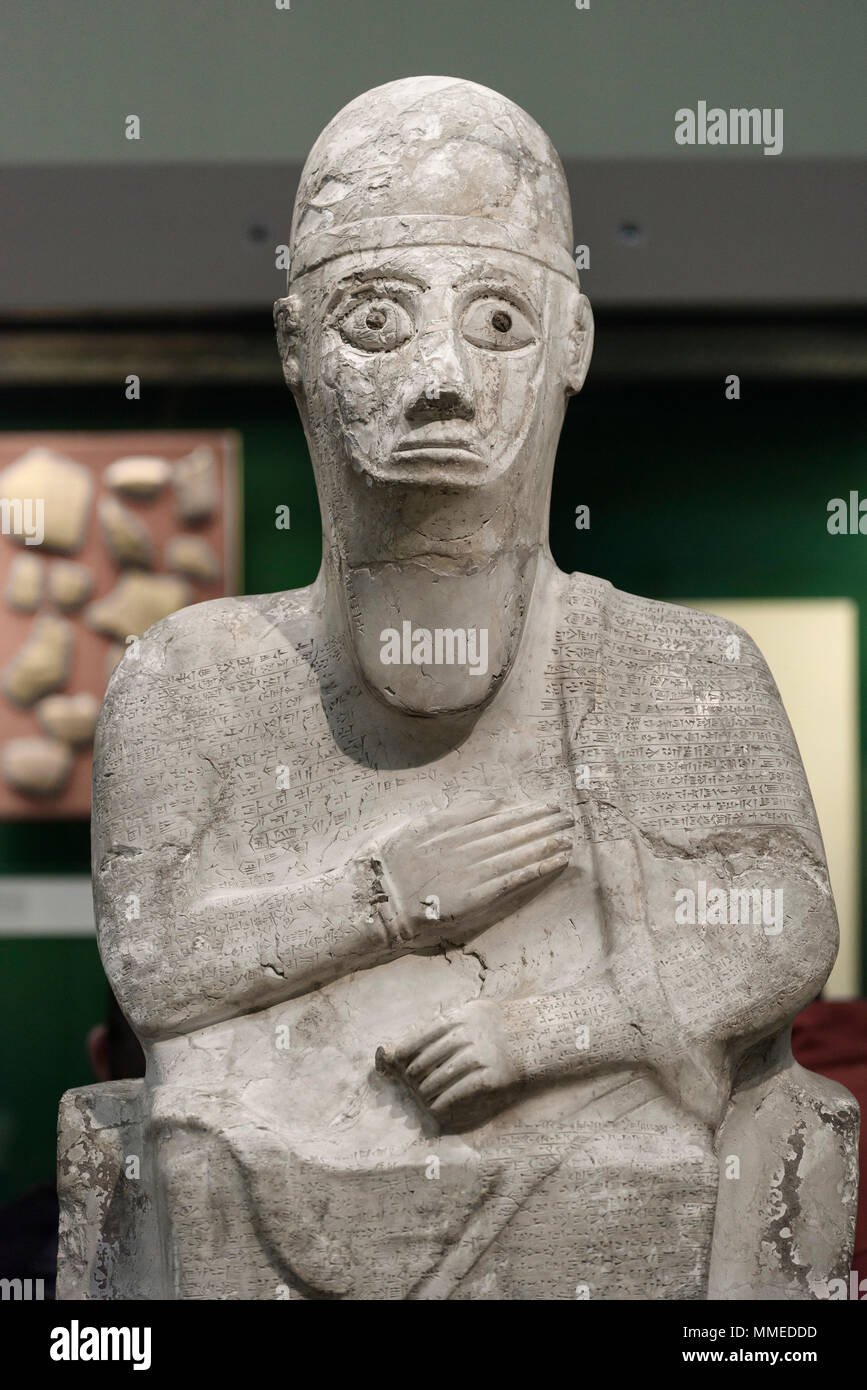 London. England. British Museum. Statue of King Idrimi of Alalakh, (1570-1500 BC), with autobiographical Akkadian Cuneiform inscription, from Tell Atc Stock Photo