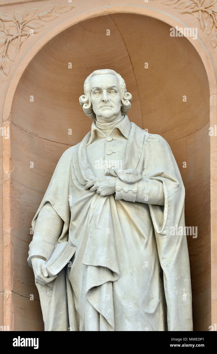 London, England, UK. Statue: Adam Smith (by William Theed) on Burlington Gardens facade of the Royal Academy (Burlington House) Cleaned and restored.. Stock Photo