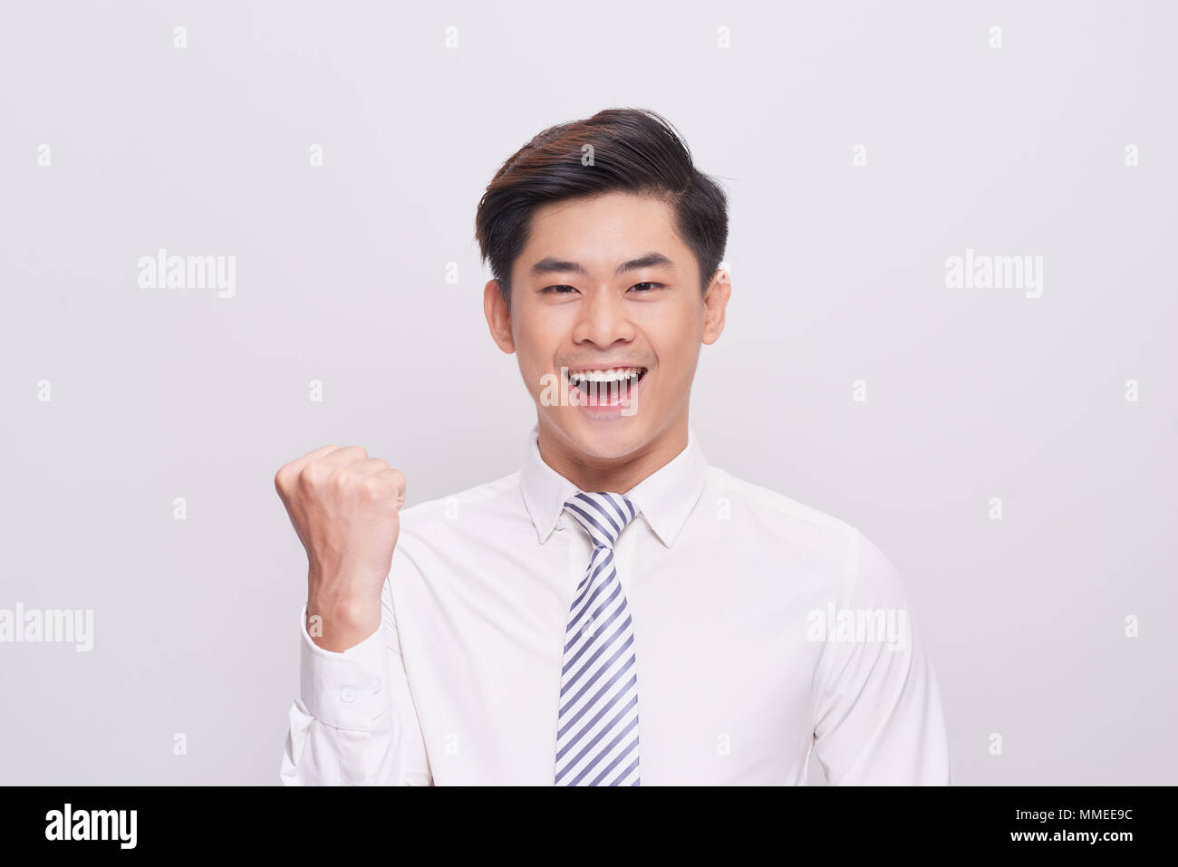 Portrait of happy excited young asian businessman Stock Photo - Alamy