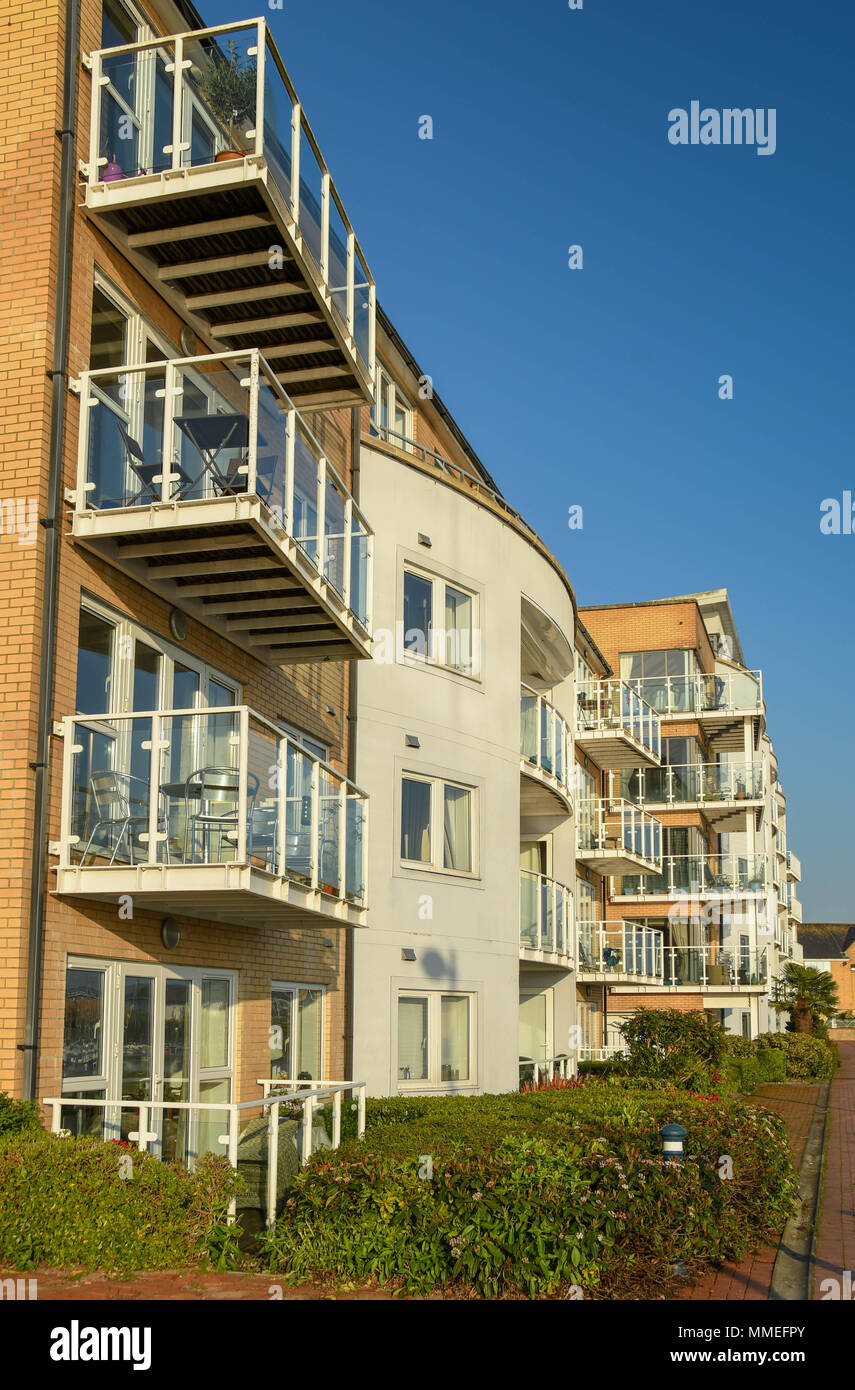 Waterside living in apartment blocks in Cardiff Bay. New homes were part of the regeneration of former dockland areas Stock Photo