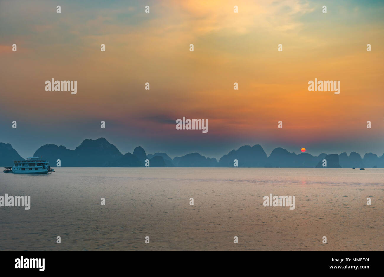 Sunset in Halong Bay, Vietnam. It is Unesco World Heritage Site and most visited place near Hanoi. Stock Photo