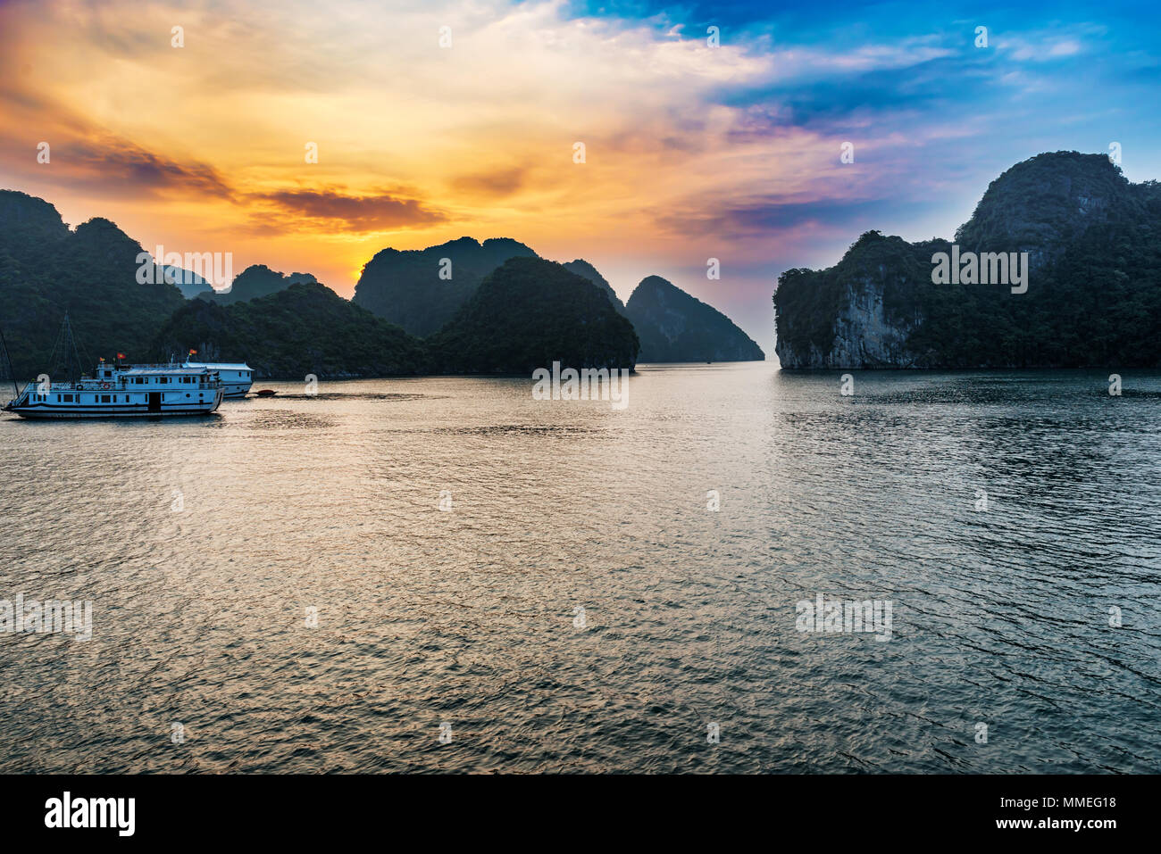 Sunset in Halong Bay, Vietnam. It is Unesco World Heritage Site and most visited place near Hanoi. Stock Photo